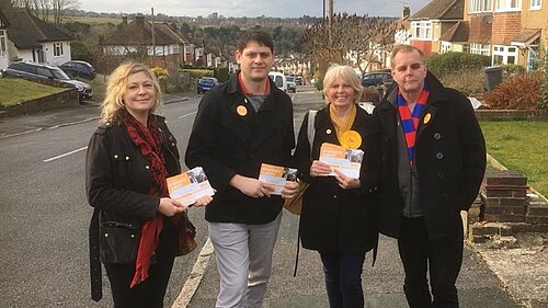 Lib Dem campaigners with a resident's survey
